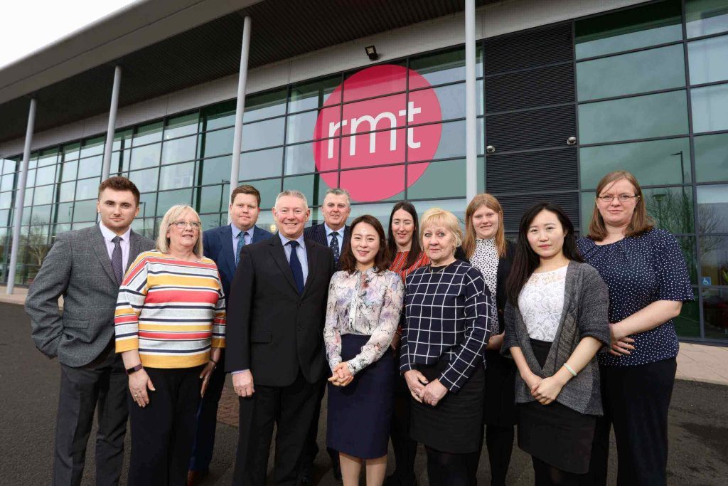 A group of people standing outside the RMT offices