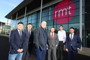 Six people standing outside of the RMT office