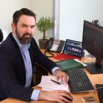 Michael Cantwell, Coirporate Finance, sitting at a desk