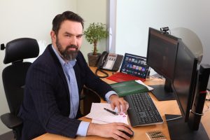 Michael Cantwell sitting at his desk