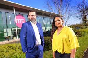 Two people standing outside the RMT offices